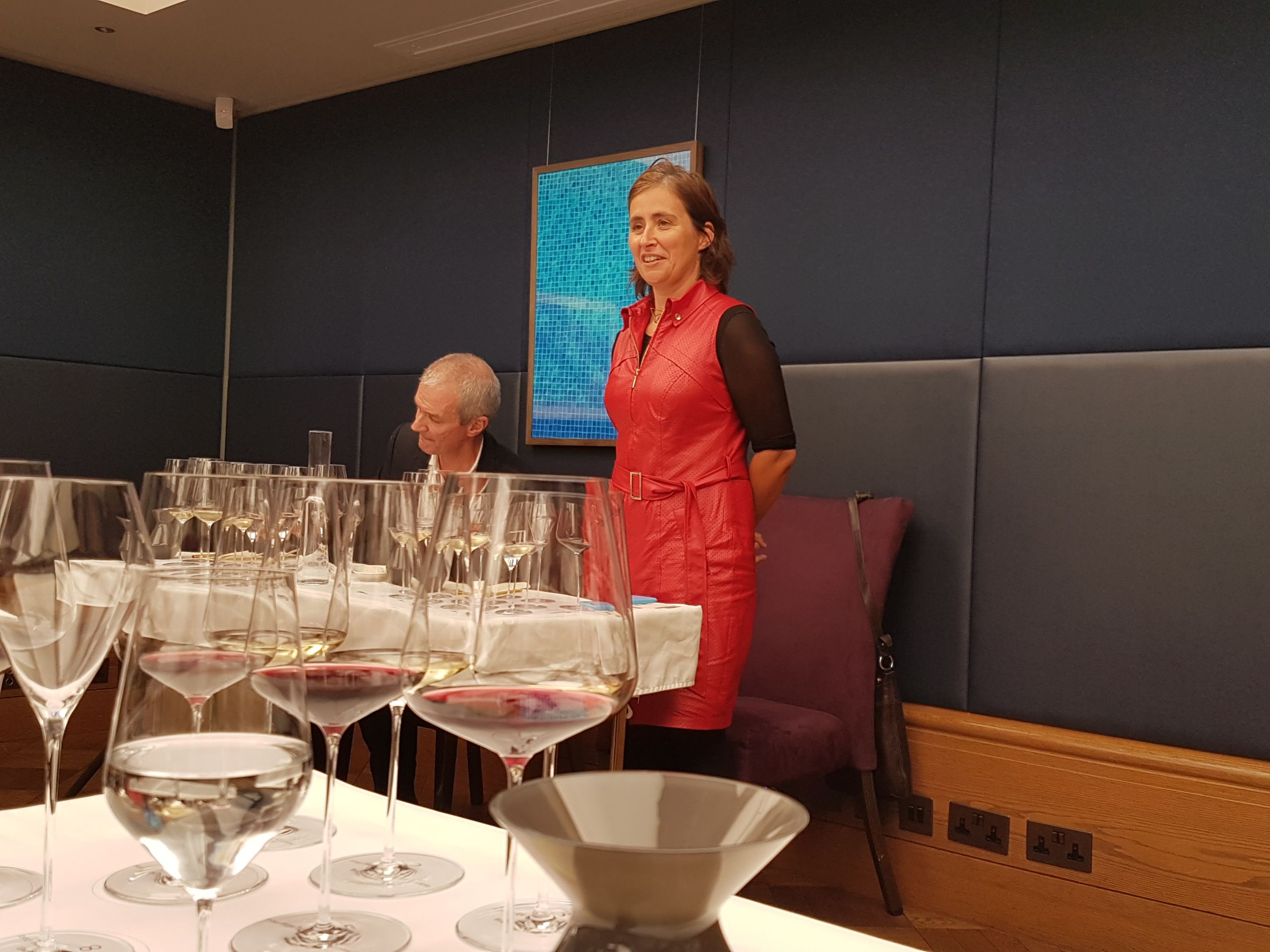 Filipa Pato giving a talk in London, tasting glasses in the foreground