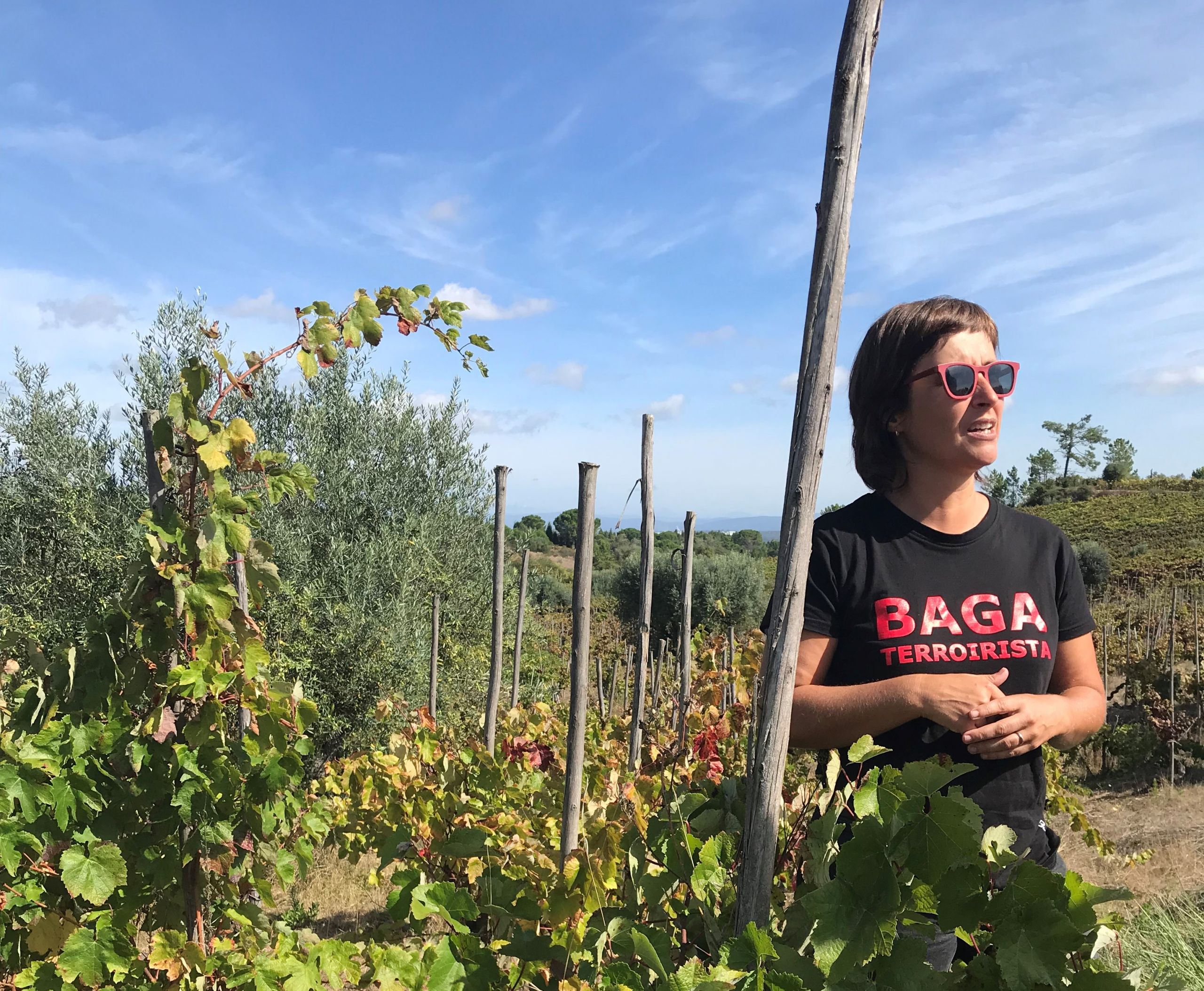 Filipa in the vineyards wearing a tshirt that says BAGA TERROIRISTA